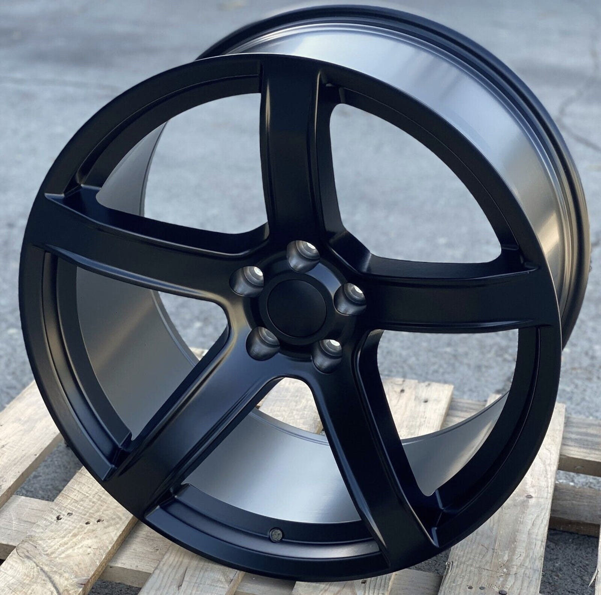 Matte black OE Style Wheels 20-inch HC2 style rims fitted on a Dodge Challenger and Charger for narrow body models.