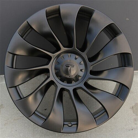 20-inch matte black Überturbine style wheels by OE Style Wheels on Tesla Model 3 and Y, showcasing sleek automotive rims.