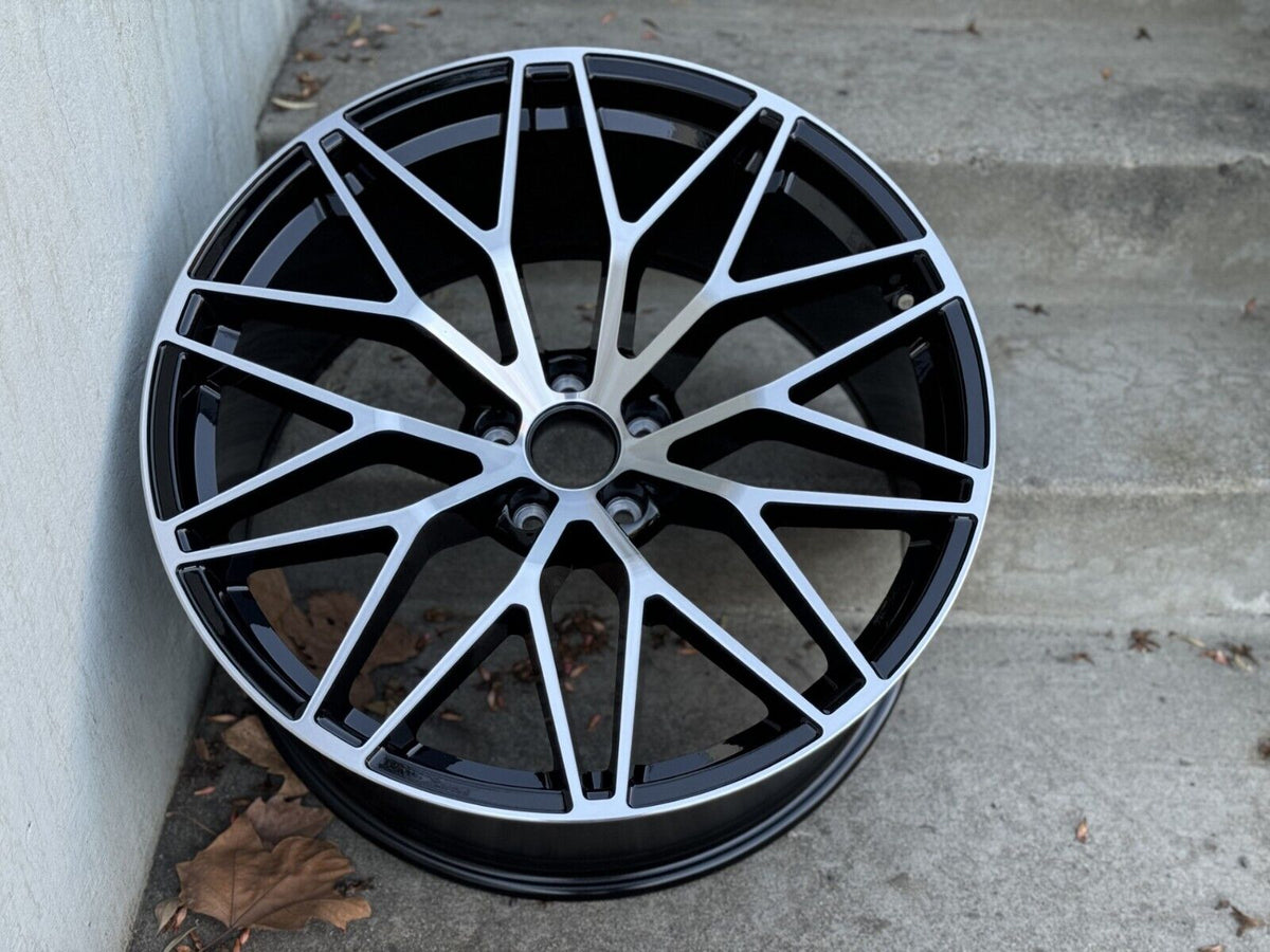Black machined 21-inch RS Spyder style wheels by OE Style Wheels on a Porsche Macan, showcasing the sleek multi-spoke design.