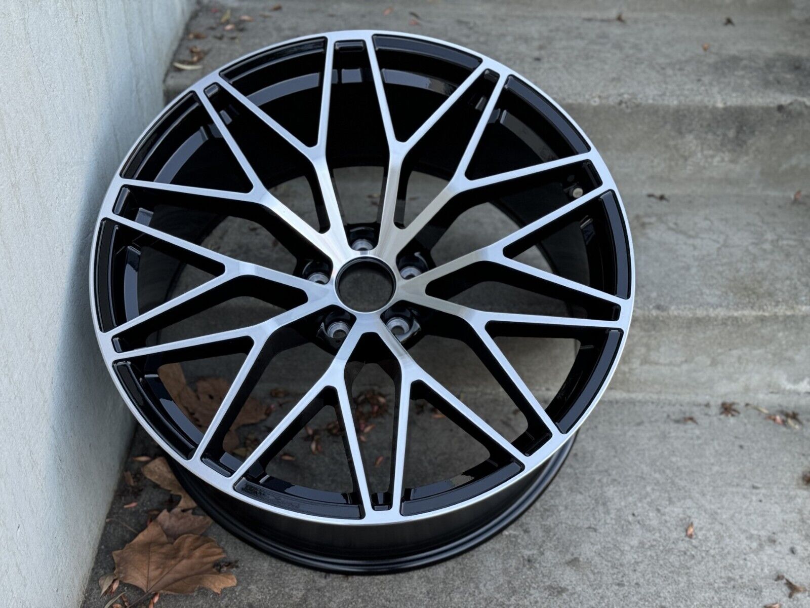 Black machined 21-inch RS Spyder style wheels by OE Style Wheels on a Porsche Macan, showcasing the sleek multi-spoke design.