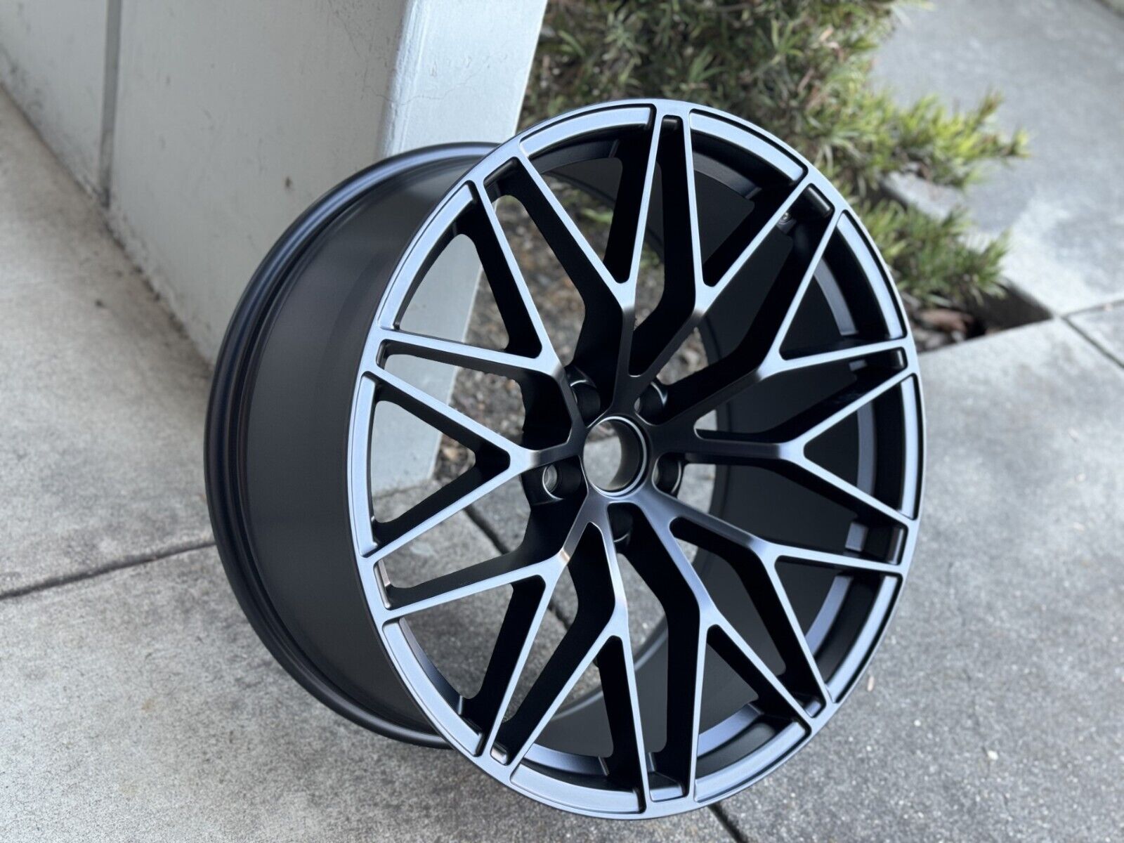 Matte black 21-inch RS Spyder style OE Style Wheels on a Porsche Macan, showcasing sleek, sporty alloy wheel design.