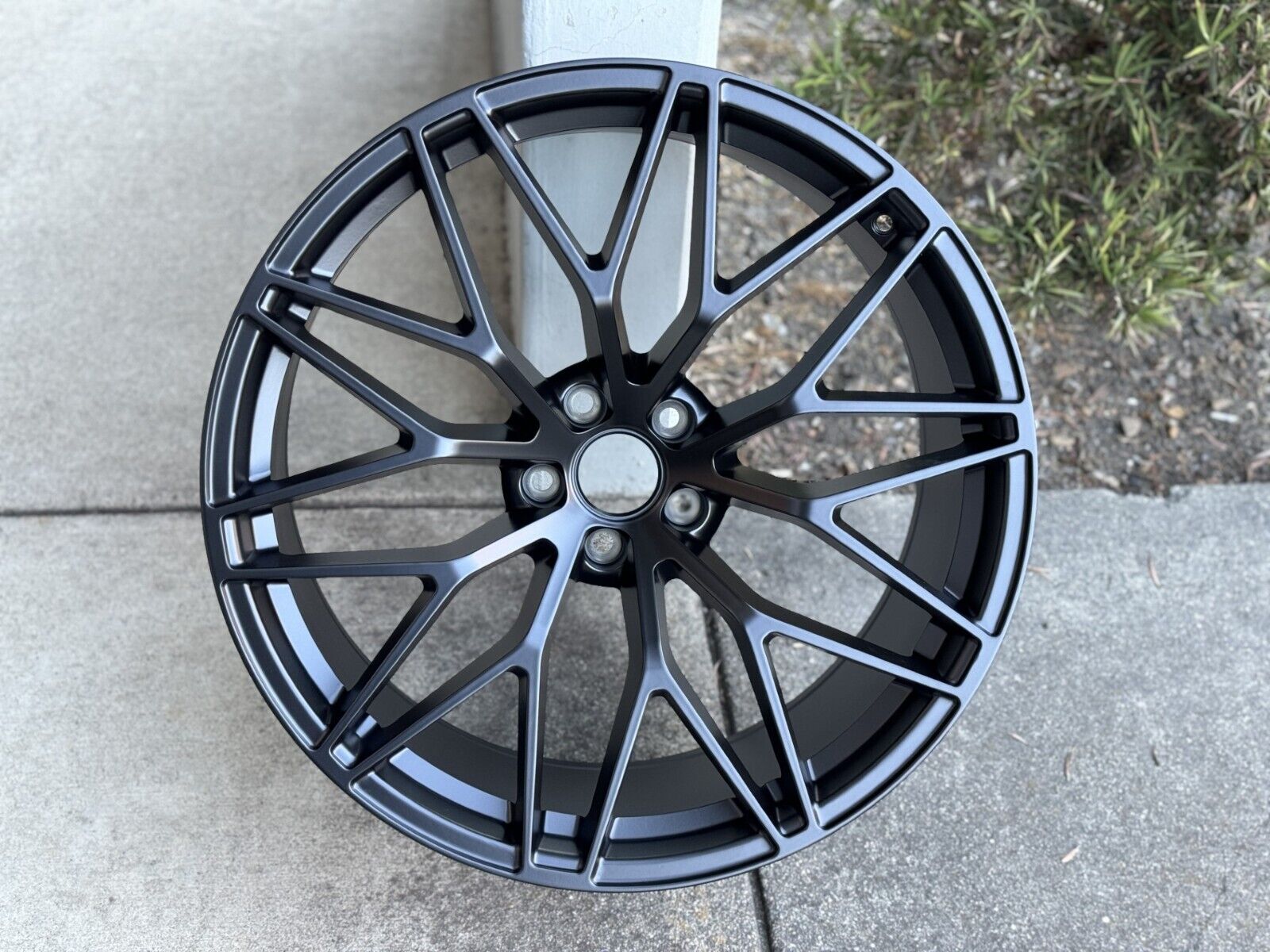 21-inch RS Spyder style matte black wheels from OE Style Wheels installed on a Porsche Macan.