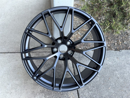 21-inch RS Spyder style matte black wheels from OE Style Wheels installed on a Porsche Macan.