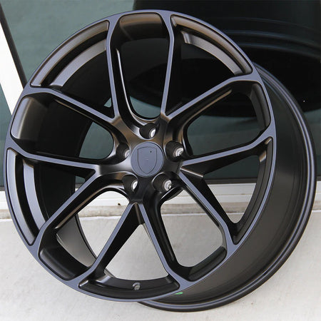 21-inch Turbo Style matte black wheels by OE Style Wheels on a Porsche Macan, showcasing sleek, sporty alloy rims.