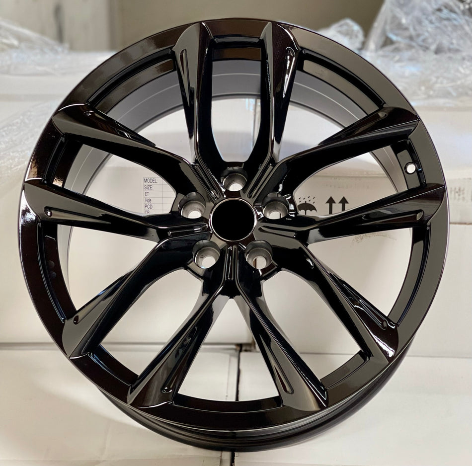 20-inch gloss black alloy wheels for Tesla Model 3 AWD, RWD, and Performance by OE Style Wheels, shown mounted on vehicle.