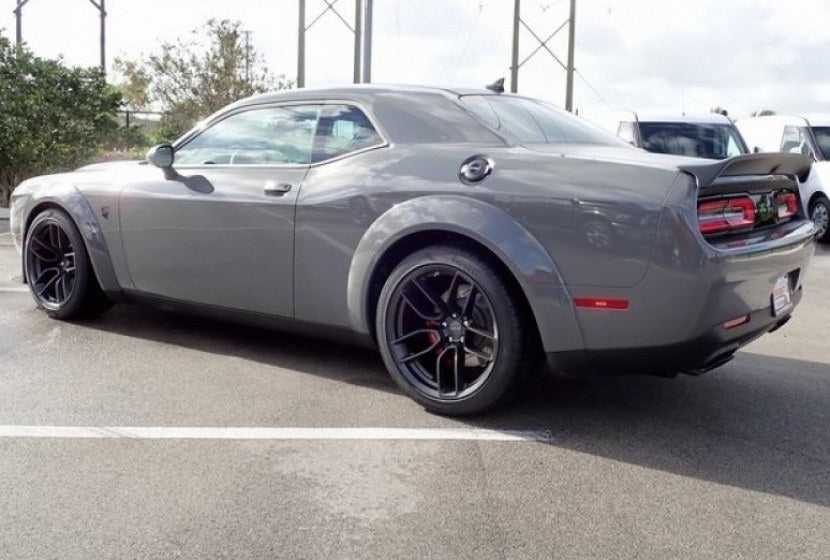 20-inch matte black Hellcat style wheels by OE Style Wheels on Dodge Challenger and Charger models, showcasing a bold automotive rim design.