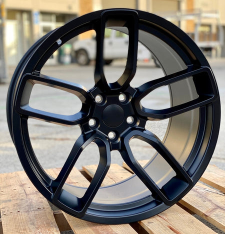 20-inch matte black Hellcat style wheels by OE Style Wheels on a Dodge Challenger or Charger, showcasing bold automotive rims.