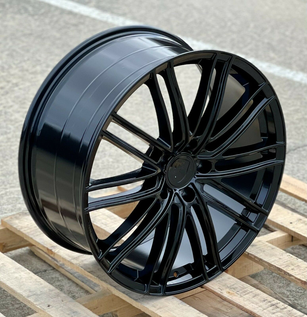 22-inch GTS style gloss black wheels by OE Style Wheels for Porsche Cayenne GTS Diesel Hybrid Turbo, showing sleek automotive rims.