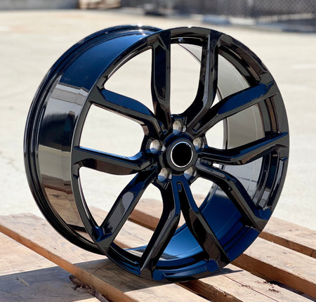 22-inch SVR Style gloss black wheels by OE Style Wheels on Range Rover Evoque and Velar, showcasing sleek automotive rims.