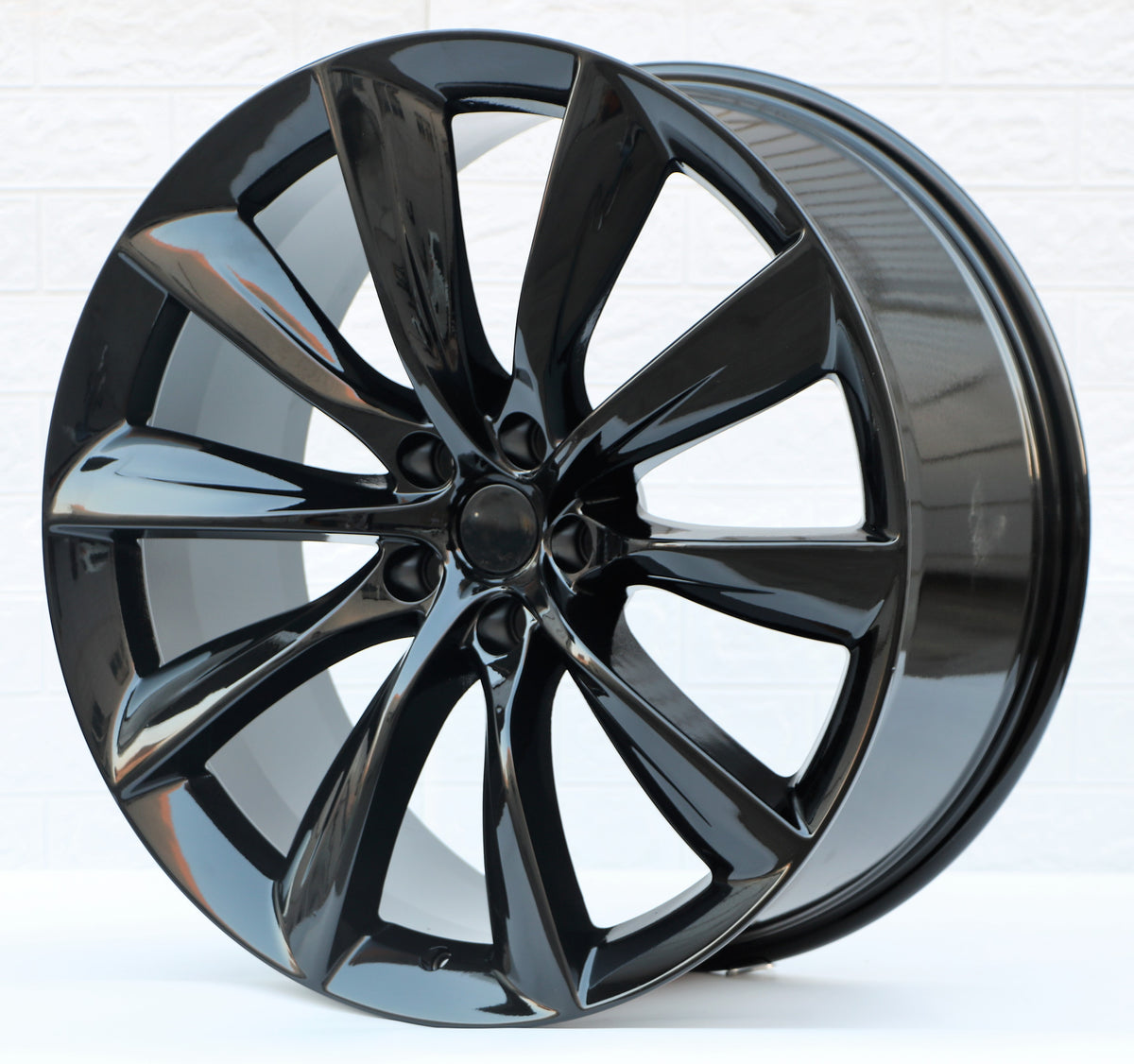 22-inch gloss black turbine style wheels by OE Style Wheels for Tesla Model Y AWD RWD Long Range Performance, showing the spoke design.