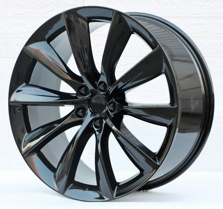 22-inch gloss black turbine style wheels by OE Style Wheels for Tesla Model Y AWD RWD Long Range Performance, showing the spoke design.